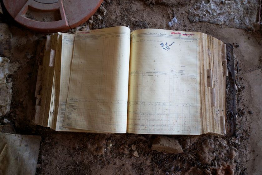 An open notebook used to log documents that were discarded